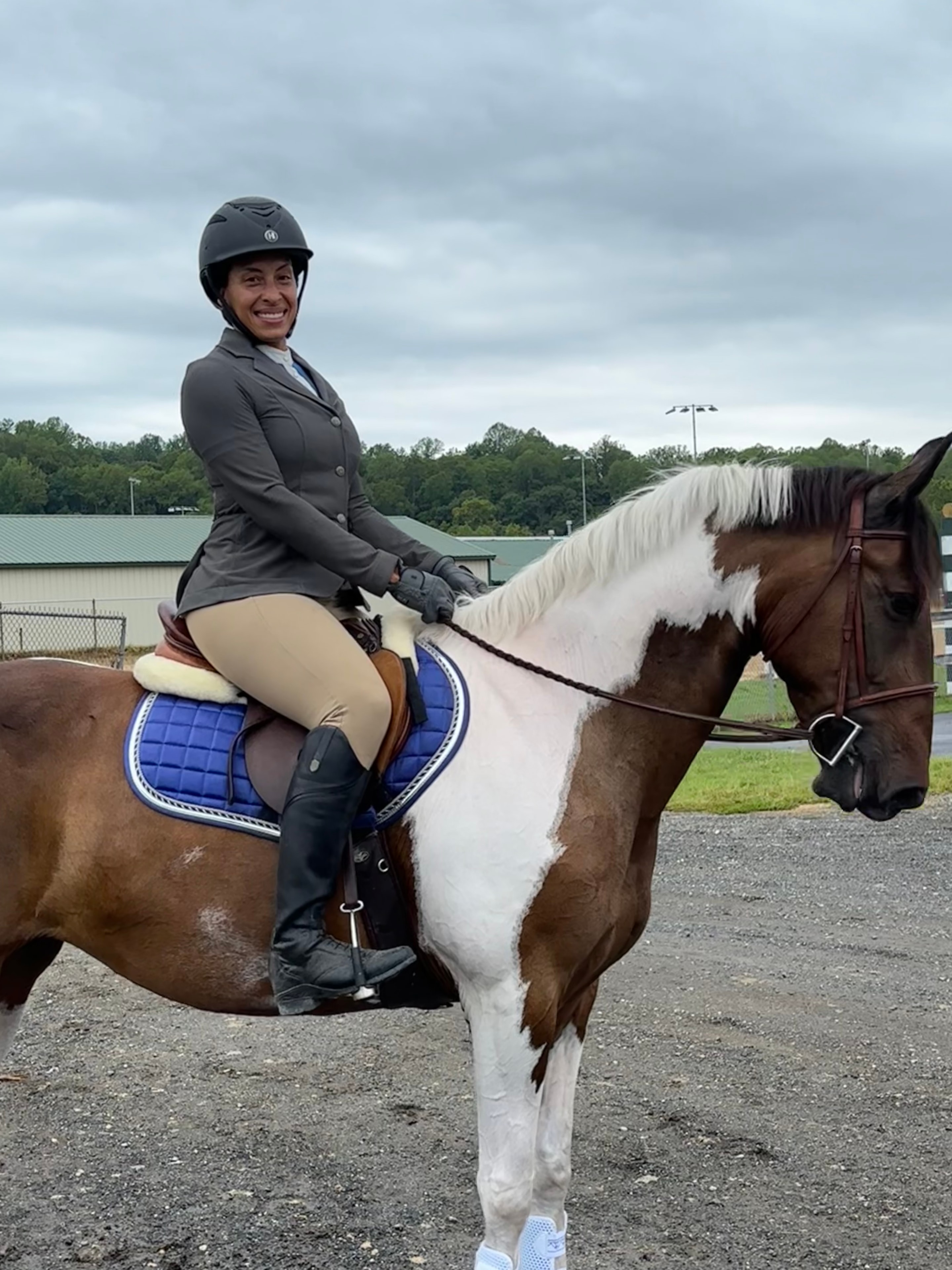Janet Hayes competing on horseback in the arena at Westbrook Horse Farm